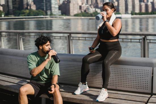 couple drinking water during a workout